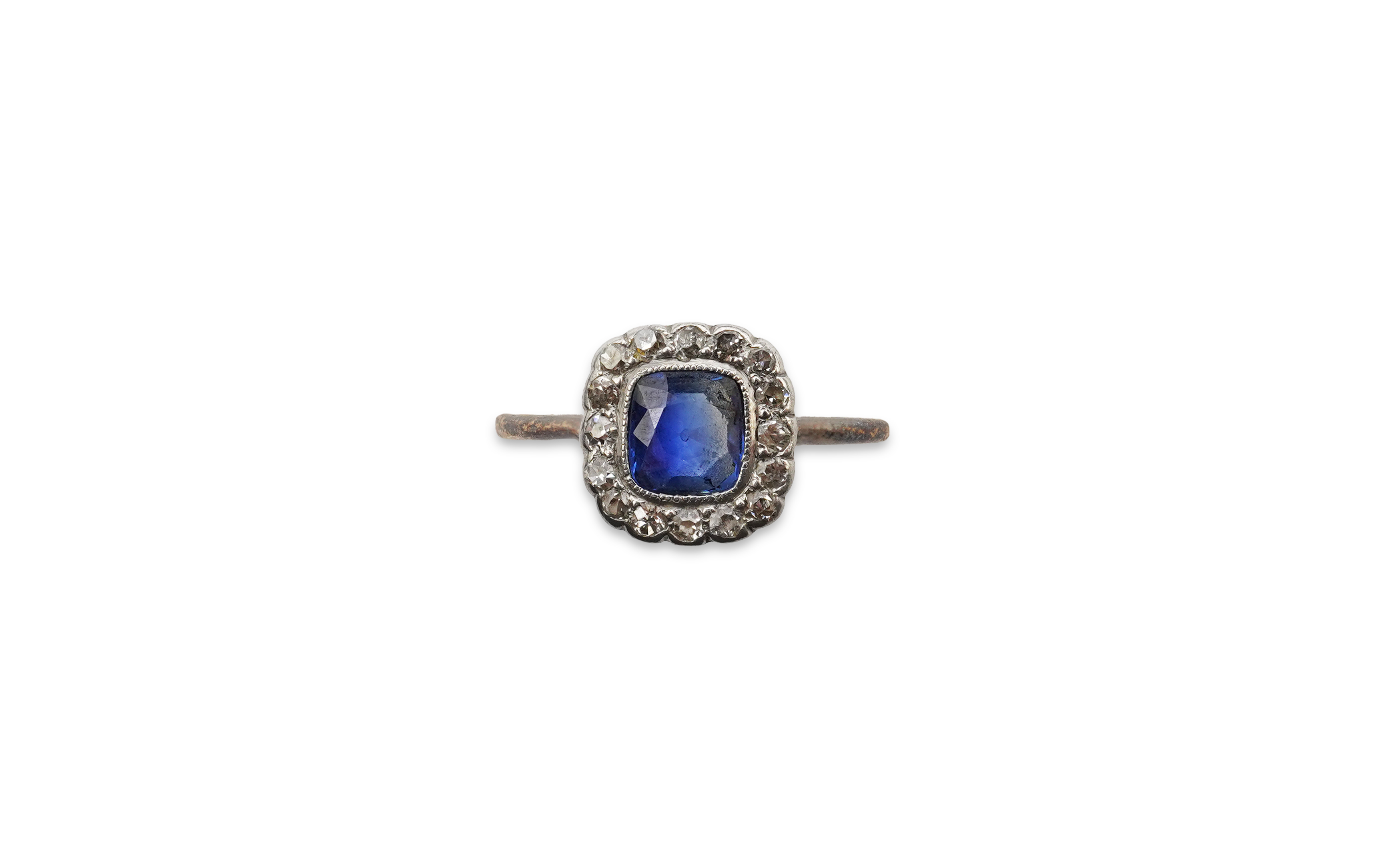 A sapphire and diamond cluster ring, early 20th century